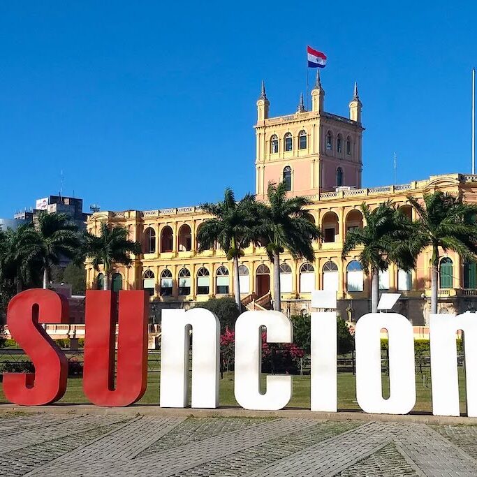 Asuncion sign and Lopez Presidential Palace, Paraguay
